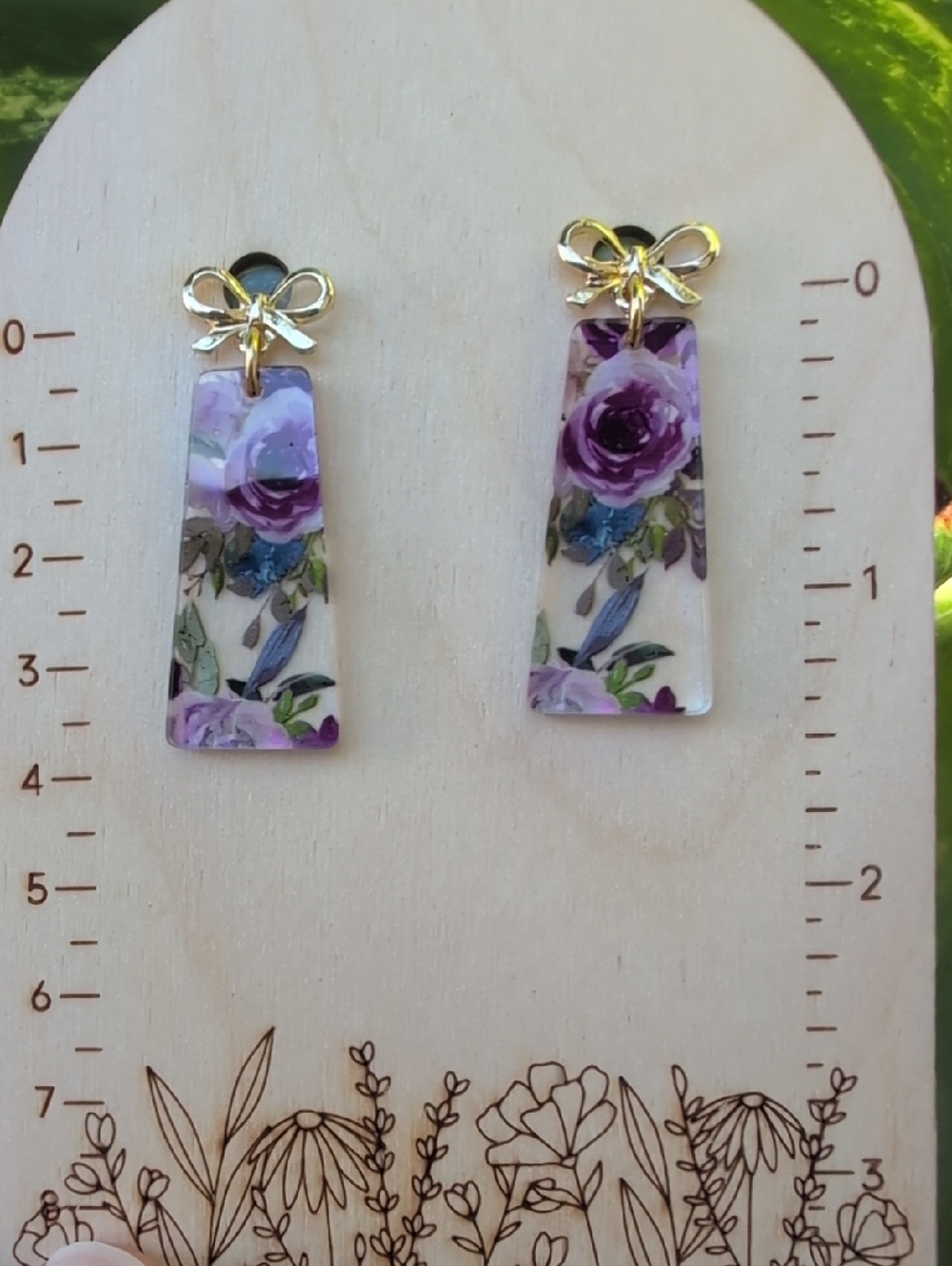 Gold Bow Drop Acrylic Earrings with Purple Floral Design